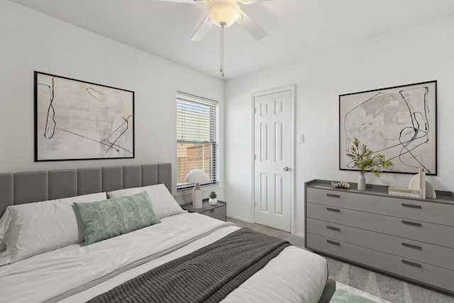 carpeted bedroom featuring ceiling fan