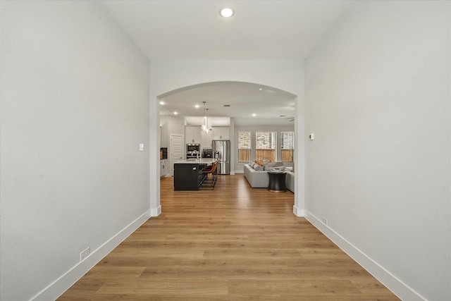 hallway featuring light hardwood / wood-style flooring