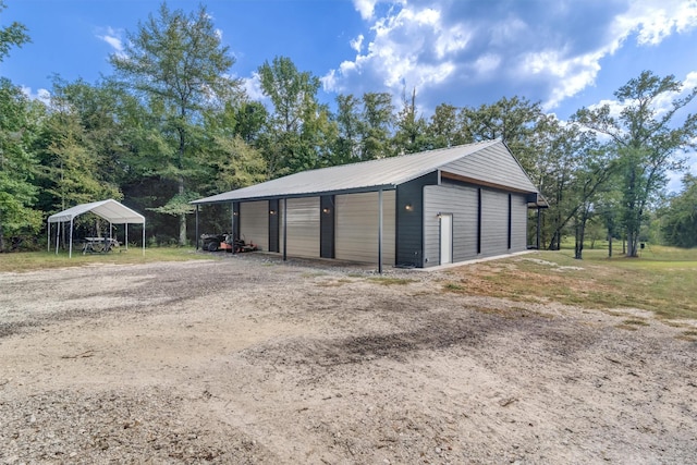 garage featuring a carport