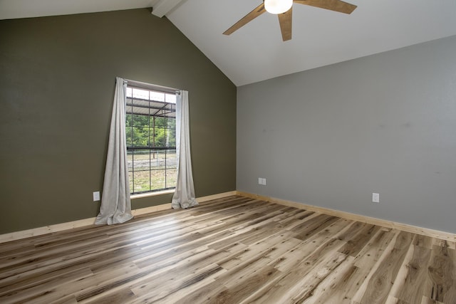 spare room featuring ceiling fan, high vaulted ceiling, beam ceiling, and light hardwood / wood-style floors