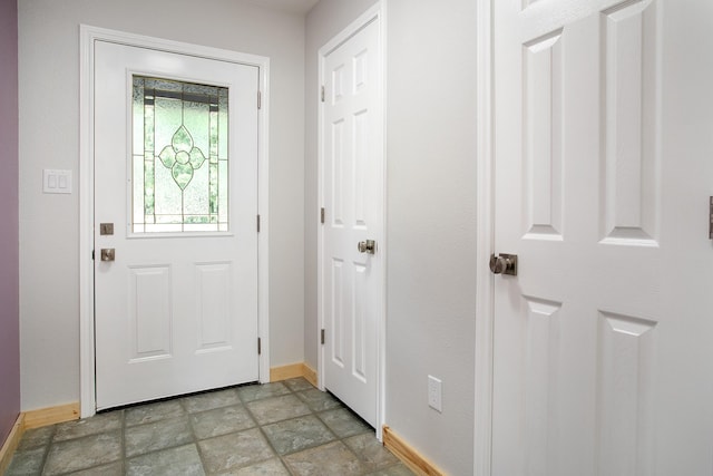 2048 County Road 3540, Hawkins, TX 75765 - doorway to outside with stone finish flooring and baseboards