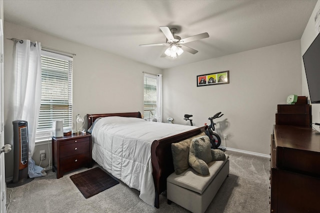 bedroom with light carpet and ceiling fan