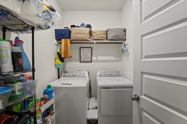 clothes washing area featuring washer and clothes dryer