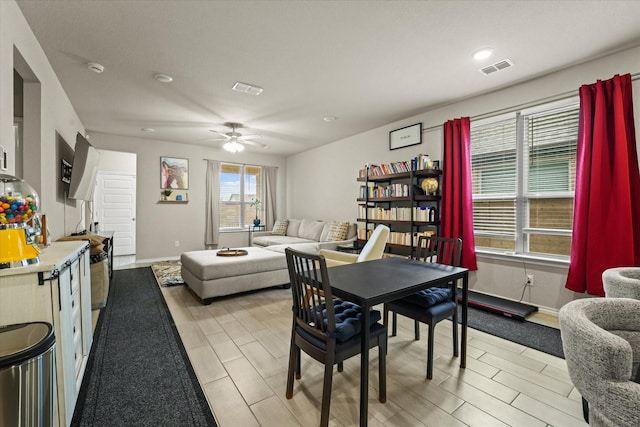 dining space featuring ceiling fan, baseboards, and recessed lighting