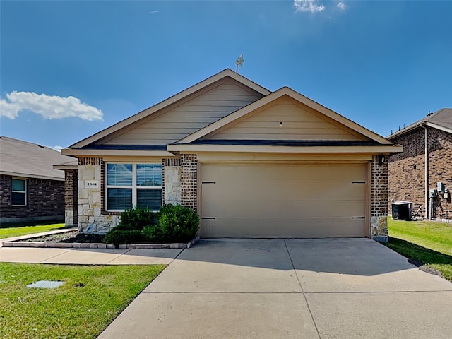 2002 Grimes Dr, Forney, TX 75126 - ranch-style house featuring concrete driveway, a garage, central air condition unit, and brick siding