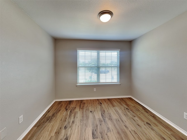 2002 Grimes Dr, Forney, TX 75126 - unfurnished room with wood finished floors and baseboards