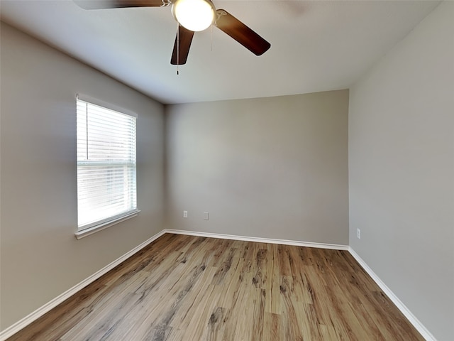 2002 Grimes Dr, Forney, TX 75126 - spare room with wood finished floors, baseboards, and a ceiling fan