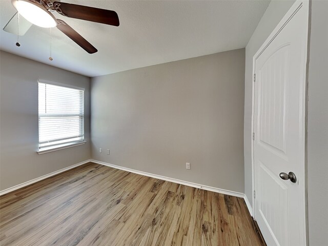 2002 Grimes Dr, Forney, TX 75126 - spare room with wood finished floors, baseboards, and ceiling fan