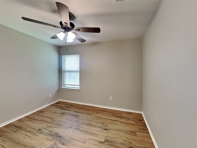 2002 Grimes Dr, Forney, TX 75126 - unfurnished room featuring a ceiling fan, wood finished floors, and baseboards