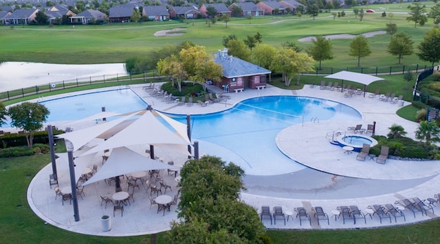 view of pool featuring a yard and a patio area