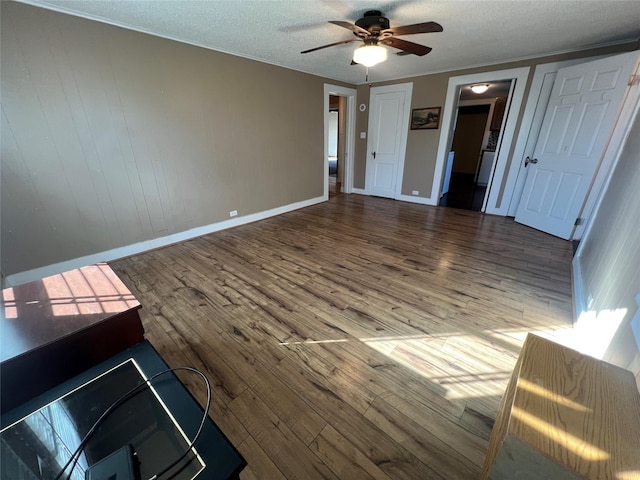 interior space with hardwood / wood-style floors, a textured ceiling, and ceiling fan