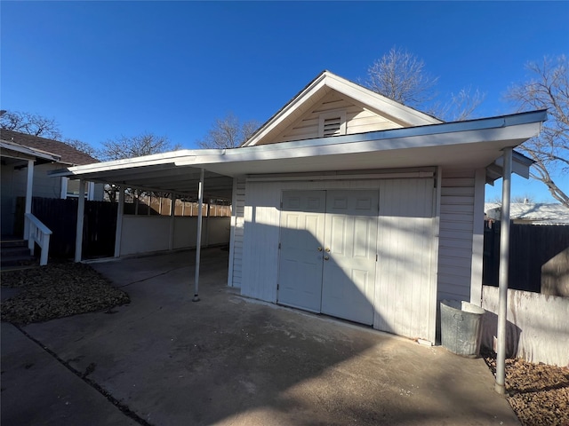 garage featuring a carport