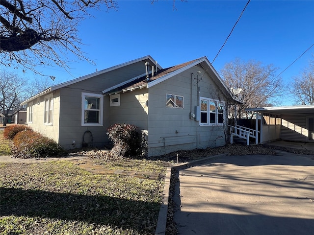 view of property exterior with a carport