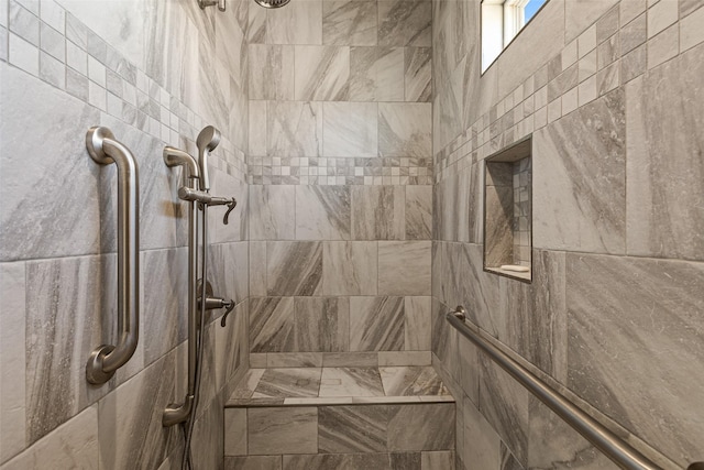 bathroom featuring a tile shower