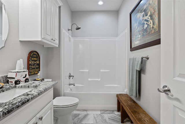 full bathroom featuring toilet, vanity, and bathtub / shower combination