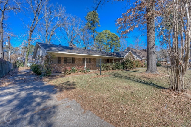 ranch-style house with a front lawn