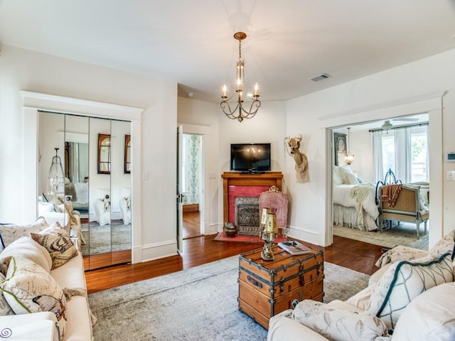 living room with hardwood / wood-style flooring and a chandelier