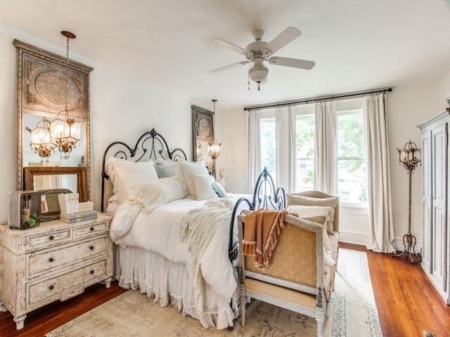 bedroom featuring hardwood / wood-style flooring and ceiling fan