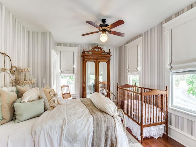 bedroom featuring ceiling fan and hardwood / wood-style floors