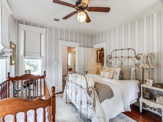 bedroom featuring wood-type flooring and ceiling fan