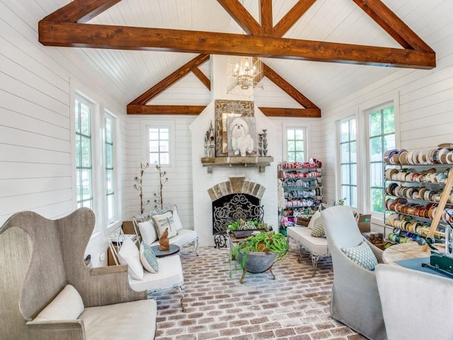 living room featuring lofted ceiling with beams and wood walls