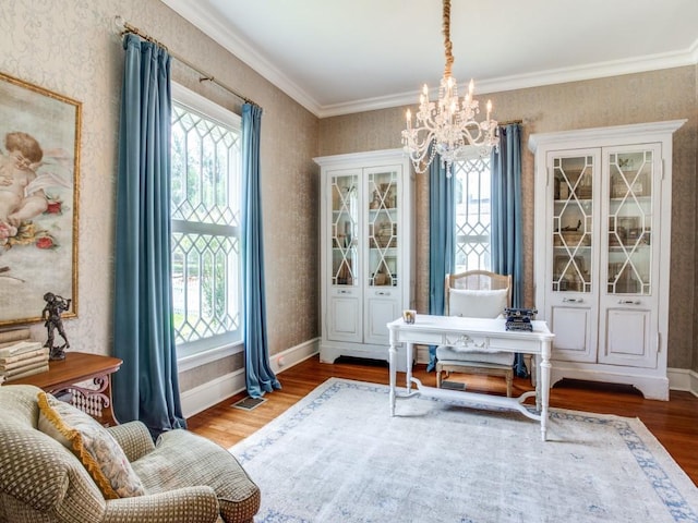 sitting room featuring ornamental molding, a notable chandelier, and dark hardwood / wood-style flooring