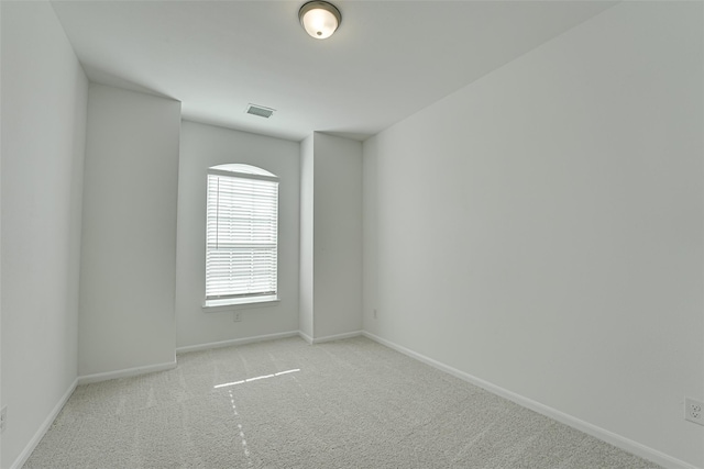 empty room with light colored carpet