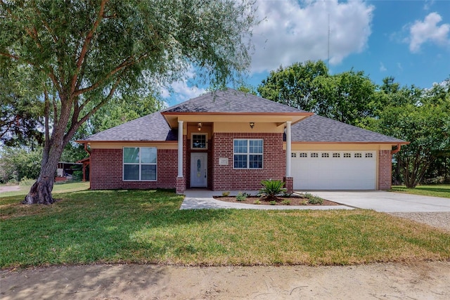 view of front of house with a garage and a front yard