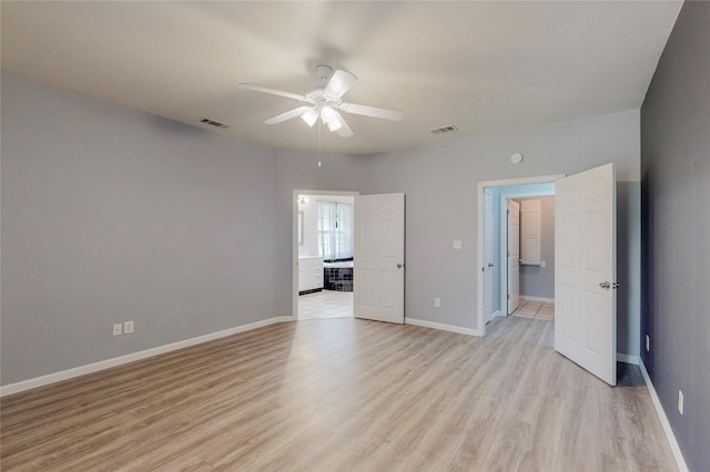 interior space with ceiling fan and light hardwood / wood-style flooring