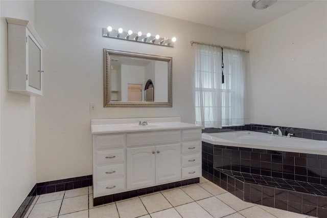 bathroom featuring vanity, tile patterned floors, and tiled bath