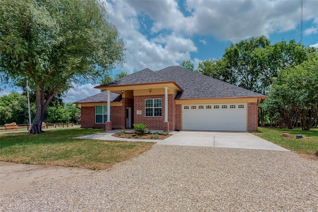 single story home featuring a garage and a front yard