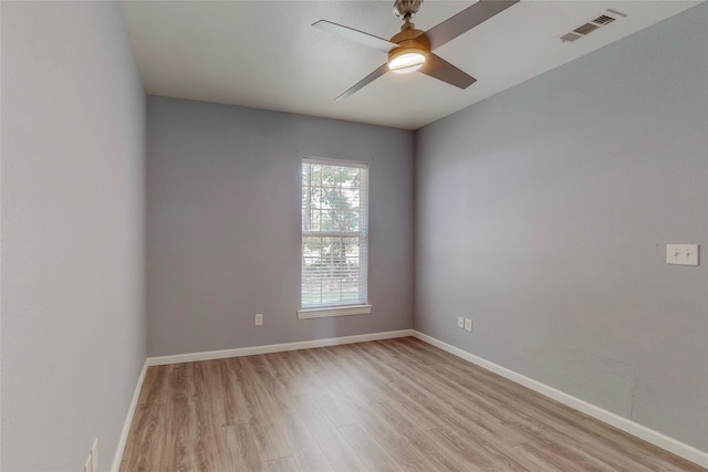 empty room with ceiling fan and light wood-type flooring