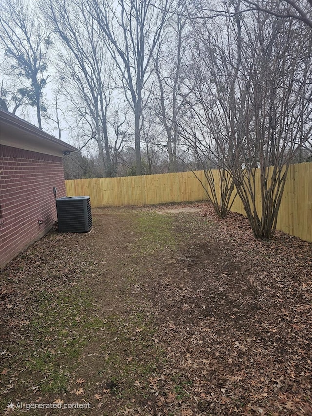 view of yard with central air condition unit