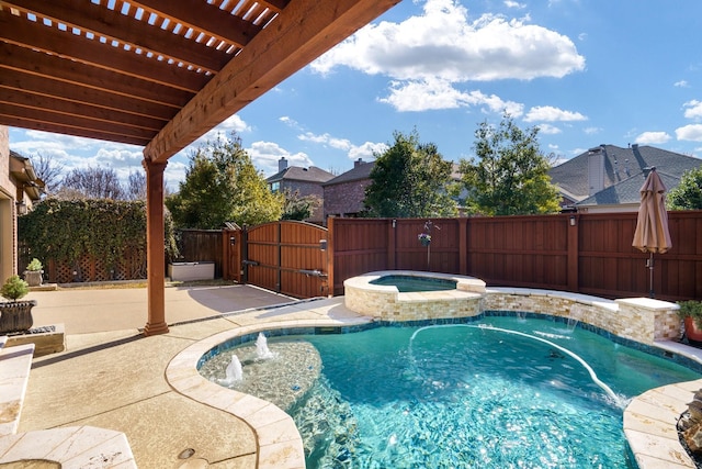 view of swimming pool featuring a pergola, pool water feature, and an in ground hot tub