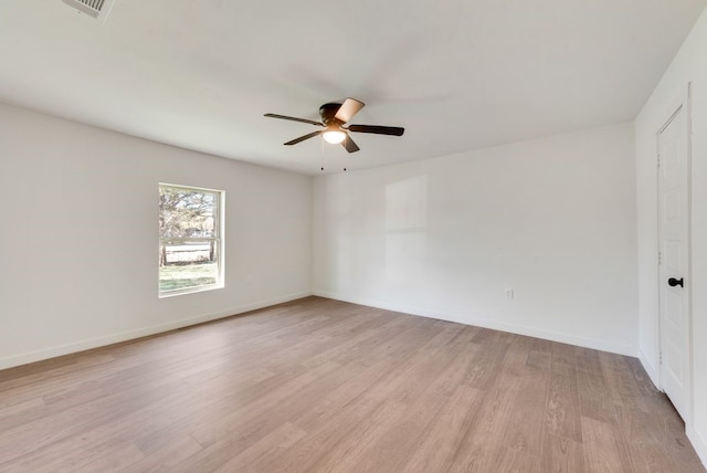 spare room featuring ceiling fan and light hardwood / wood-style floors