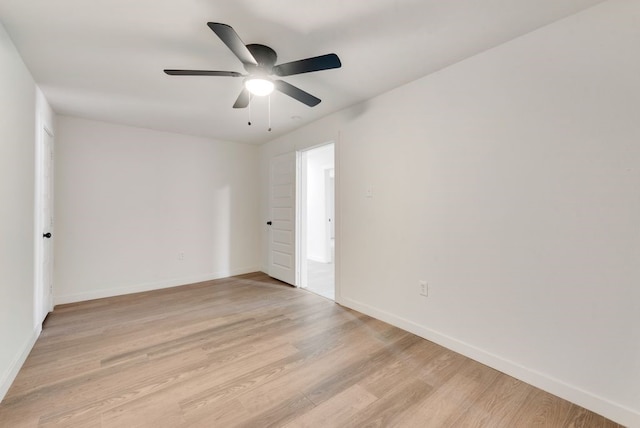 empty room with light hardwood / wood-style flooring and ceiling fan