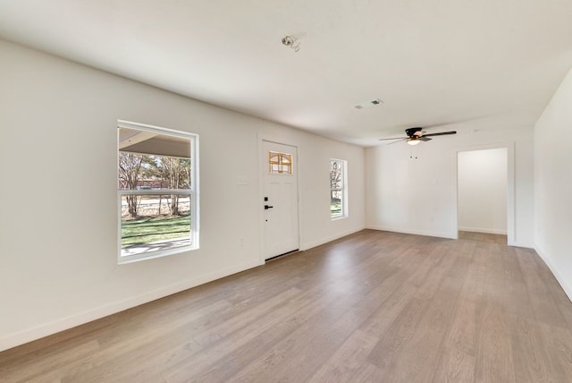 foyer featuring light hardwood / wood-style floors and ceiling fan