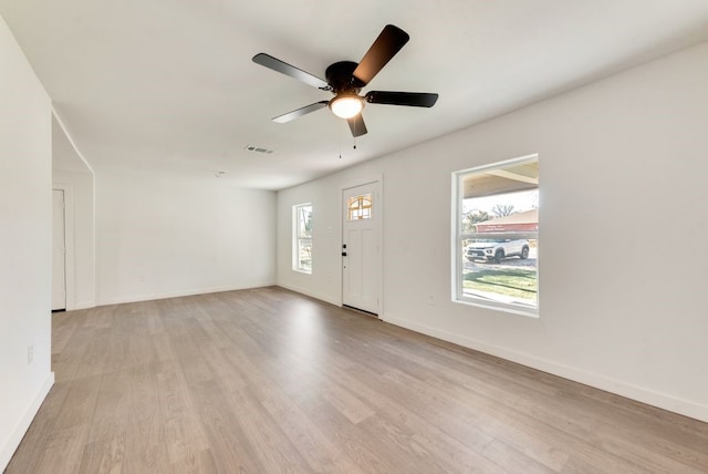 foyer featuring ceiling fan and light hardwood / wood-style floors