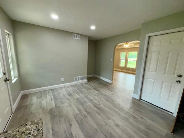 unfurnished room with light hardwood / wood-style flooring