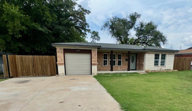 single story home with a garage and a front yard