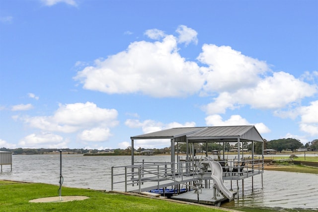 dock area featuring a water view and a lawn