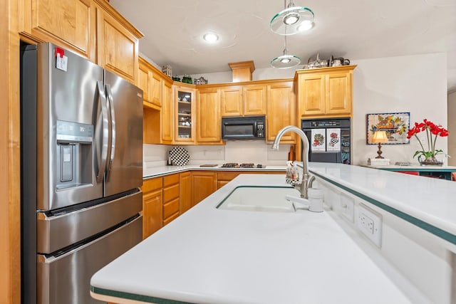 kitchen featuring sink and black appliances