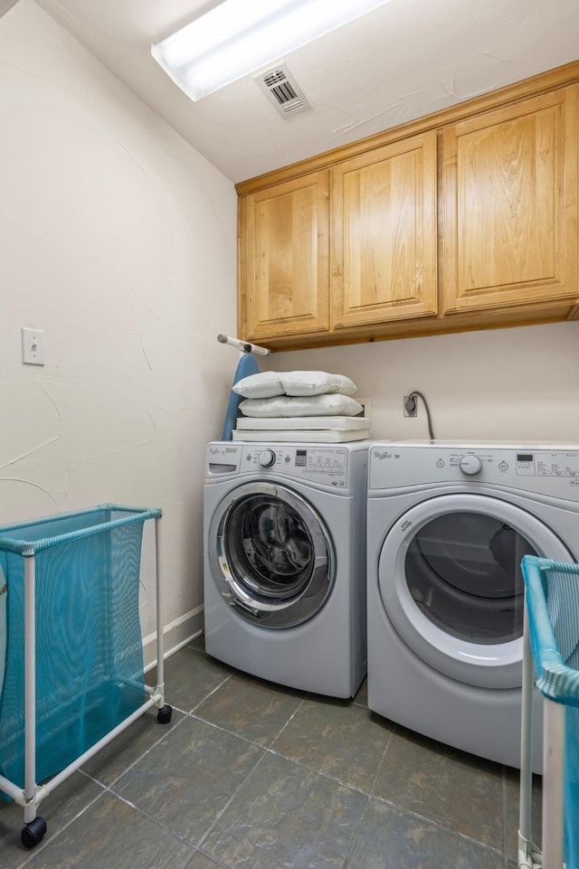 laundry area with cabinets and independent washer and dryer