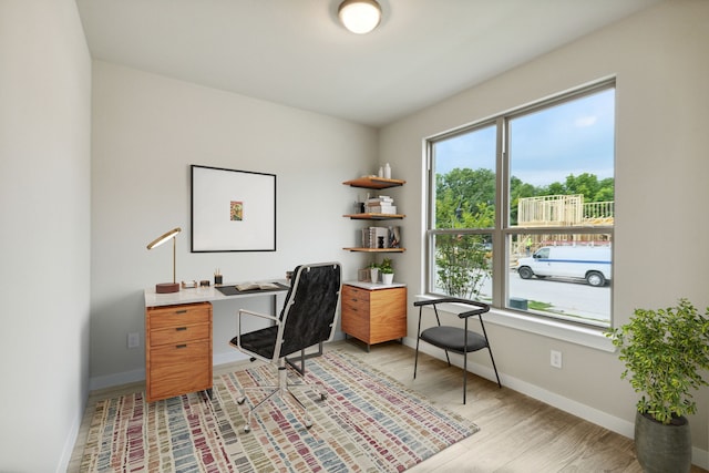 office space with light hardwood / wood-style flooring