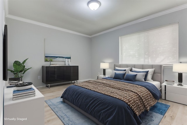 bedroom with ornamental molding, light wood-type flooring, and baseboards