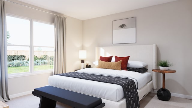 bedroom featuring light colored carpet and baseboards