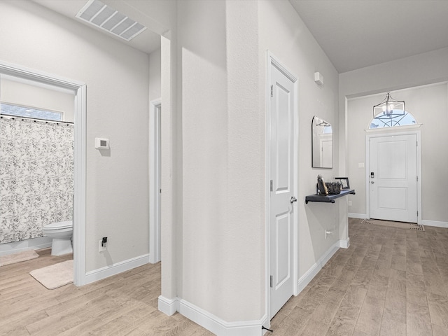 hallway with light wood-type flooring