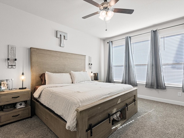 carpeted bedroom with multiple windows and ceiling fan