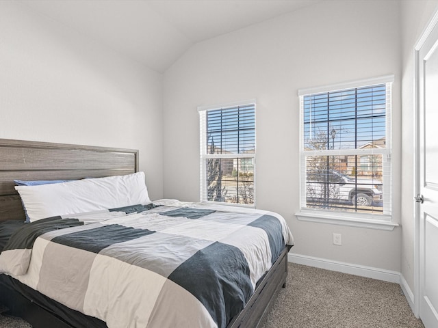 carpeted bedroom with vaulted ceiling