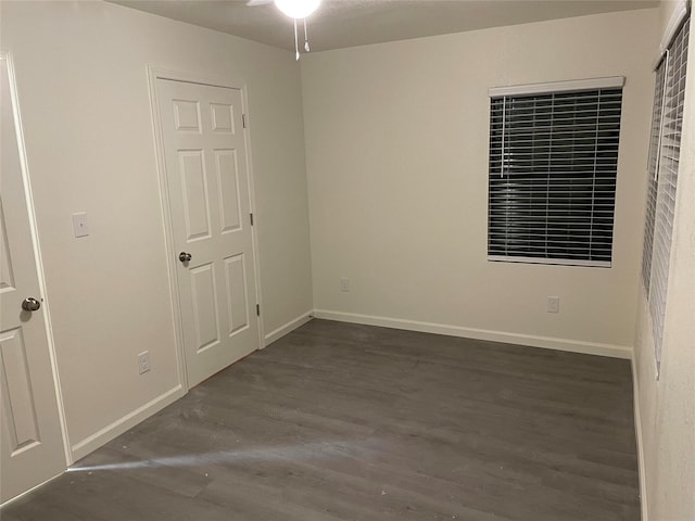 spare room featuring dark wood-type flooring